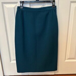 Beautiful vintage teal wool skirt from Simpsons.  Waist is 26"